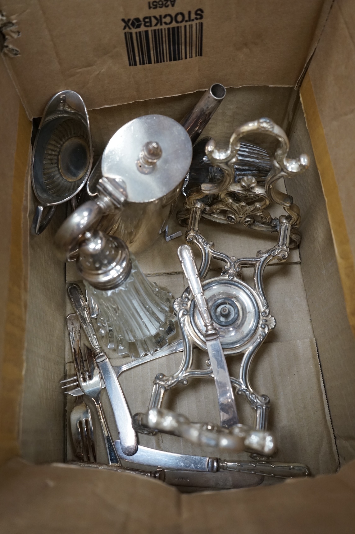 A plated tea kettle and other assorted plated ware.